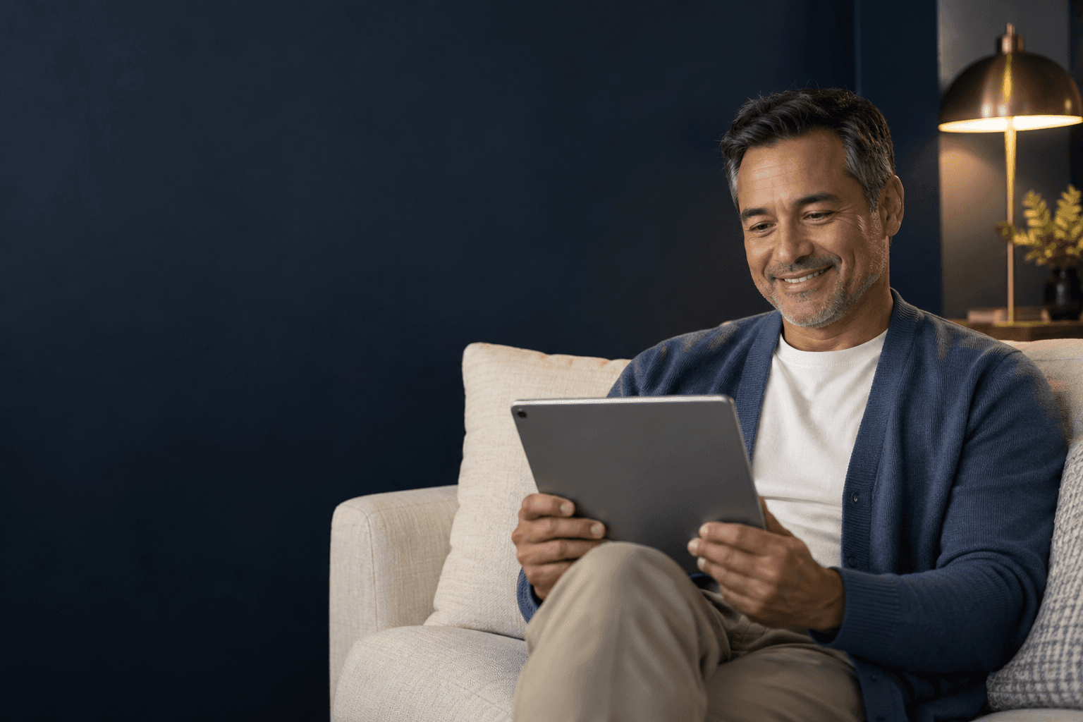 Patient using a tablet during a telehealth visit from home
